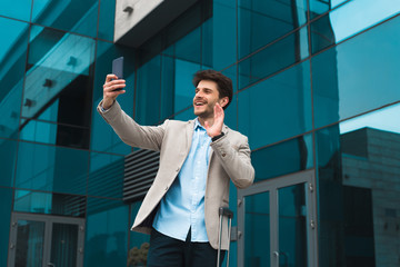 Newcomer businessman! Cheerful awesome entrepreneur with charming smile having an online...