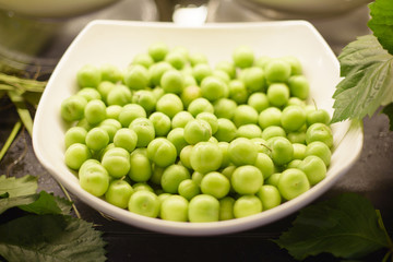 green plums on a plate