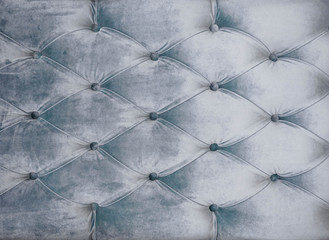 Coach-type velours screed tightened with buttons. Gray chesterfield style quilted upholstery...