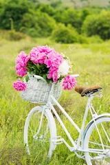 Peel and stick wall murals Peonies White retro bicycle with basket full of peonies in nature in spring. Natural lighting, no retouch.