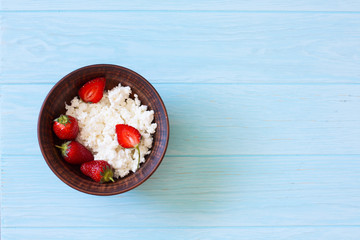 Healthy breakfast of cottage cheese and fresh strawberries