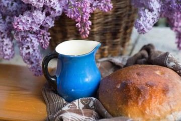 Bread,blue pitcher and lilac.