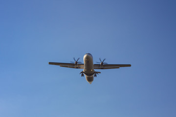big commercial airplane at landing with clear blue sky background