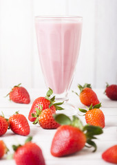 Milkshake glass with fresh summer berries smoothie