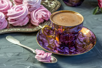 Hot chocolate in a beautiful Golden Cup with a pink marshmallow home made