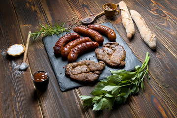 Delicious grilled meat on a dark background.