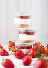 Plastic container with strawberry cream dessert