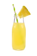Pineapple juice in a milk bottle style glass with straw isolated on a white background