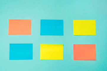 sticky stickers for notes on a blue background. time management, creative new idea. bad memory. reminder, place for text