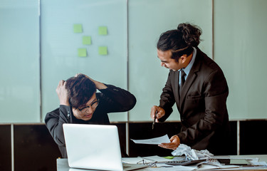 The boss is angry and scolding the employee. Because he worked fail.