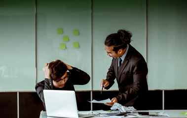 The boss is angry and scolding the employee. Because he worked fail.