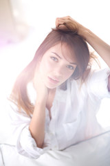 Portrait of beautiful young woman face. Isolated on white background.