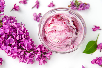 ice cream and lilac flowers spring background	