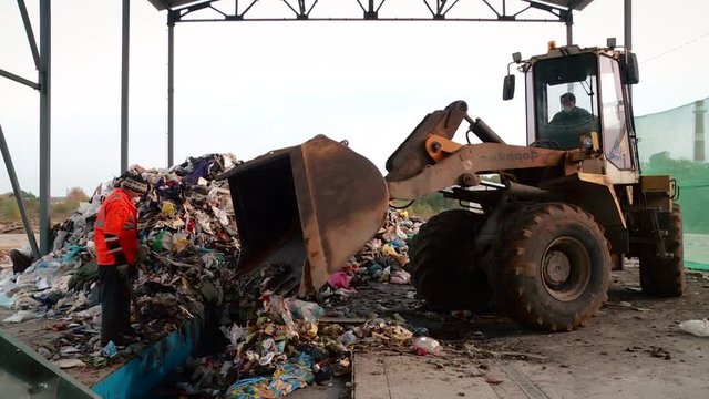 Processing of waste, garbage. Urban landfill. Sorting. Montain garbage. Ecology.