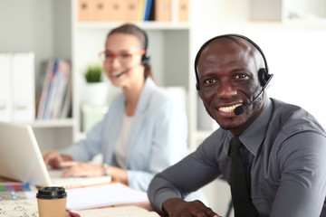 Portrait of an African American young business man with headset.
