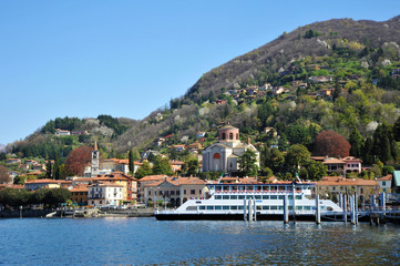Obraz premium Laveno Mombello, Italy - April 18, 2018: Laveno Mombello, located in an natural gulf of Lake Maggiore in province of Varese, Italy.