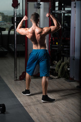 Obraz na płótnie Canvas Serious Bodybuilder Standing In The Gym