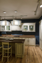 Renovated kitchen interior with lamps over counter