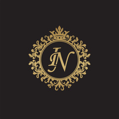 Initial letter IN, overlapping monogram logo, decorative ornament badge, elegant luxury golden color