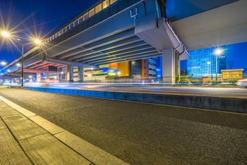 Empty urban road under the bridge