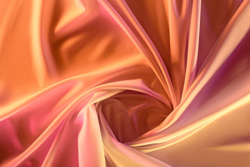 Fototapeta premium close up view of elegant pink silky fabric as background