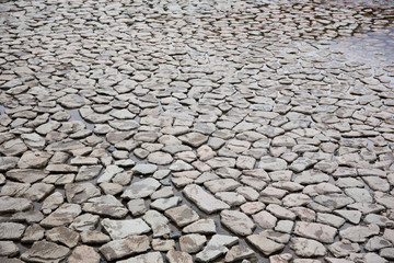 Rock ground patterns near the river. Texture for background