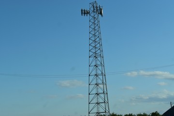 power tower of metal standing tall in the skyline