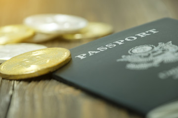 Passport placed on wooden table with Bitcoins