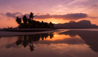 Fototapeta na wymiar twilight time sky with beach and coconut tree in evening