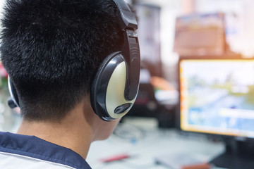 Education e-learning foreign languages Concept : Asian Student Young man wearing Headphones...