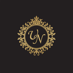 Initial letter UN, overlapping monogram logo, decorative ornament badge, elegant luxury golden color