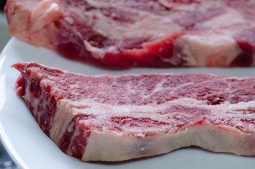 Closeup of two uncooked meat slices