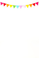 Obraz premium Colorful party flags hanging on white wall background, birthday, anniversary, celebrate event, festival greeting card background