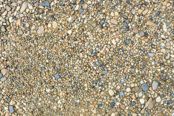 Colorful sand or pebble texture. Seamless texture on ground texture.