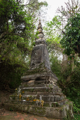 Old and aged stone stupa at the base of Mount Phousi (Phou Si, Phusi, Phu Si) in Luang Prabang, Laos.