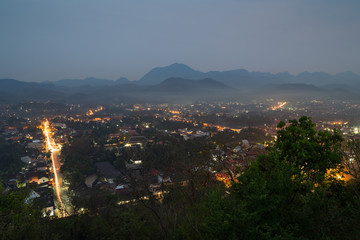 The city of Luang Prabang in Laos viewed from above from the Mount Phousi (Phou Si, Phusi, Phu Si) at dusk.
