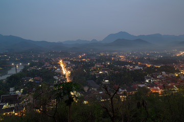 The city of Luang Prabang in Laos viewed from above from the Mount Phousi (Phou Si, Phusi, Phu Si) at dusk.