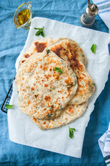 Indian flatbread - Herb stuffed paratha on a baking paper
