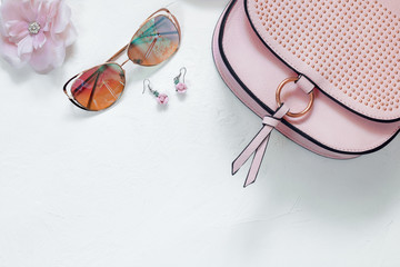 Ladies Fashion Accessories. Pink Clutch, sunglasses, earrings Pastel colors Trend