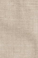 Fototapeta na wymiar Hessian sackcloth woven texture pattern background in light sepia tan beige cream brown color tone