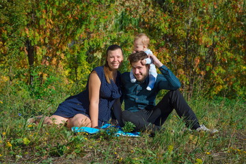 Family sitting on the grass
