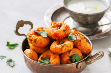 Traditional Turkish food - fellah koftes, polpettes from bulgur and semolina in tomato sauce with parsley and ayran. Middle eastern food concept.