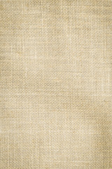 Hessian sackcloth woven texture pattern background in light cream yellow beige earth tone color