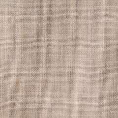 Fototapeta na wymiar Hessian sackcloth woven texture pattern background in light creme tan cream beige brown color