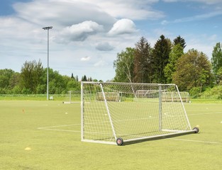 Football playground. Gate with  blue yellow nets, soccer football net.