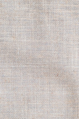 Fototapeta na wymiar Hessian sackcloth woven texture pattern background in light cream yellow beige earth color