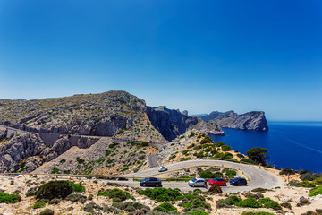 Winding road to lighthouse of Cap de Formentor and rocky coast of Mediterranean sea, Mallorca, Spain