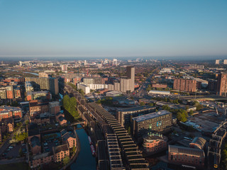 Fototapeta na wymiar Manchester City Centre Drone Aerial View Above Building Work Skyline Construction Blue Sky Summer