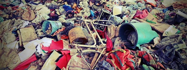 unauthorized junkyard with many abandoned objects