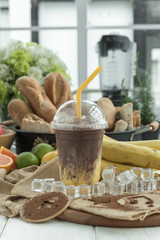 Banana smoothie with chocolate on table, Dessert made of banana smoothie and flax topped with chocolate